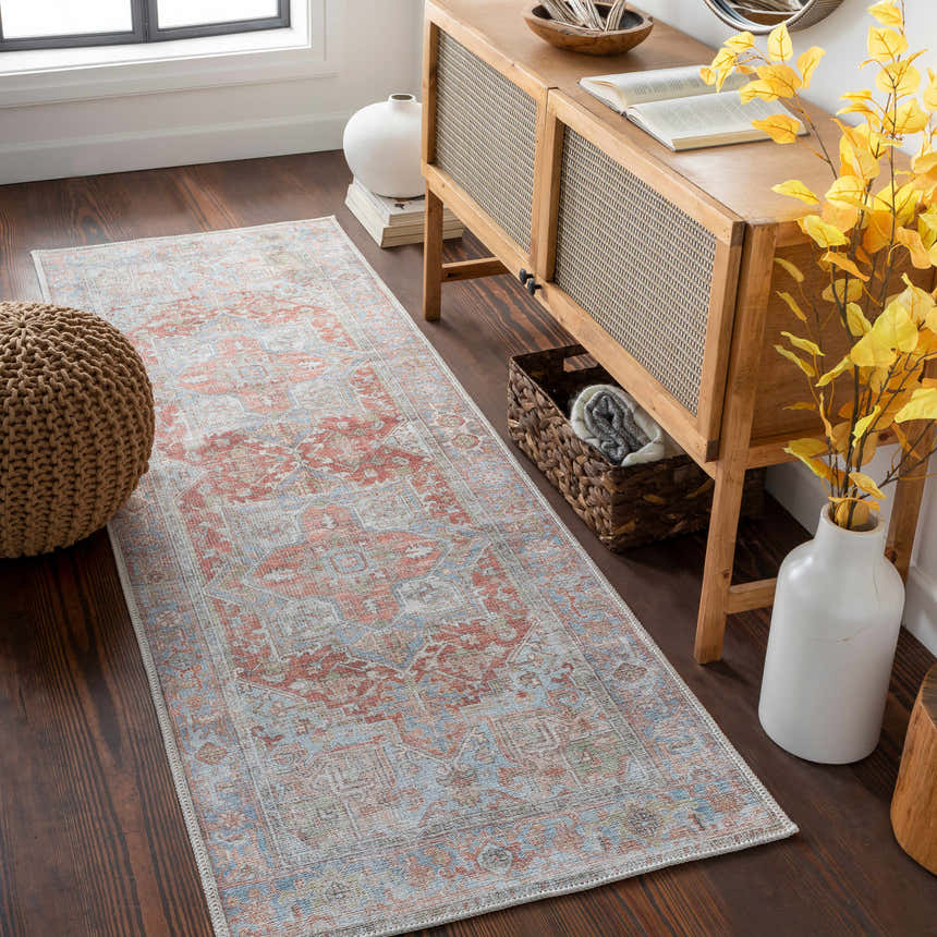 Hallway scene with a Rust Maayon Washable Rug. The rug features brick red, brown, and blue tones in an oriental pattern. Roomscene-Runner