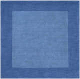 Close-up of the Macedon Blue Bordered Wool Rug. Solid design with navy blue border and lighter blue center. Hand-loomed texture. Design-Square-8