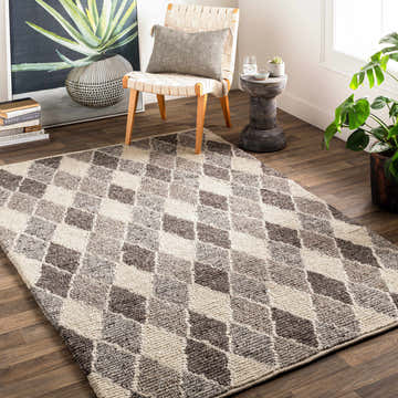 Living room scene with a gray and ivory Madden Premium Rug featuring a diamond pattern. Roomscene-Rectangle