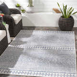 Outdoor patio scene with wicker chairs and Madras Light Blue Green All Over Performance Area Rug. Roomscene-Rectangle