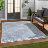 Outdoor patio scene with a Madras Light Blue Green All Over Performance Area Rug. Roomscene-Rectangle