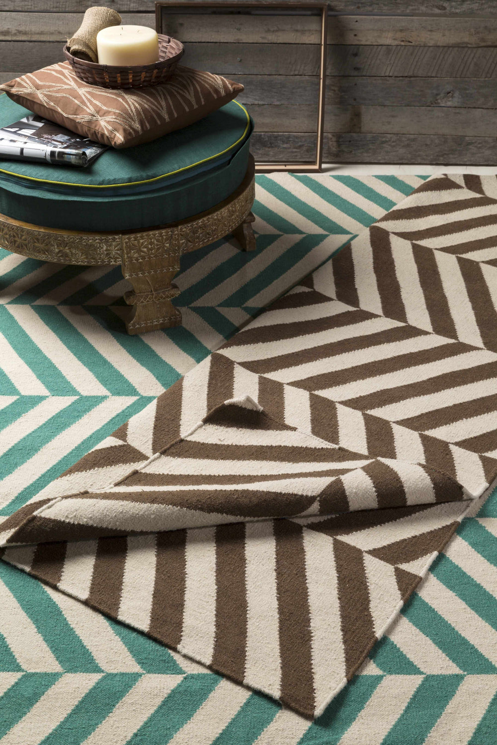 Styled scene with the Magdalena Area Carpet. Emerald and ivory striped rug with brown geometric pattern. Styleshot