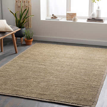 Living room scene with a light beige Magpet Area Rug, wooden bench, and indoor plants by a bright window. Roomscene-Rectangle
