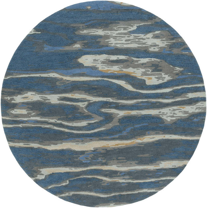 Close-up of round Maida Area Rug. Abstract pattern in blue, gray, and tan. Hand-tufted wool texture. Contemporary style. Design-Round
