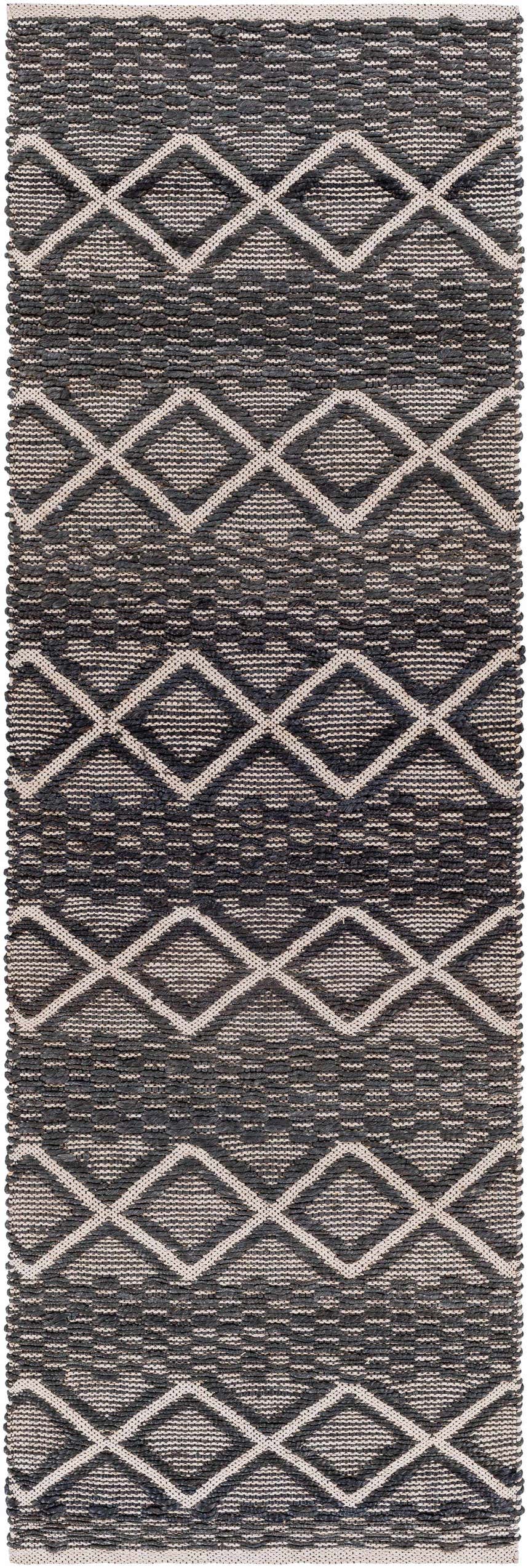 Close-up of the Maluanluan Jute Carpet. Hand-woven rug with a geometric diamond pattern in black and light beige. Design-Runner-268