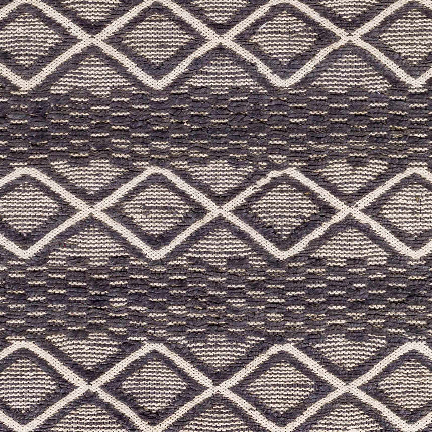 Close-up of the Maluanluan Jute Carpet showing the black and light beige diamond pattern and hand-woven texture. Swatch
