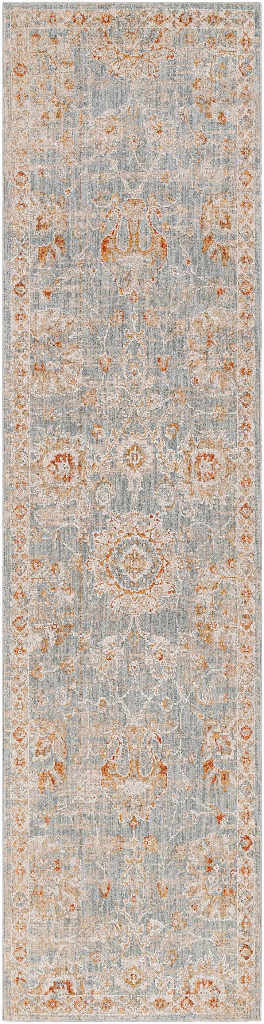 Close-up of the Mangham Thick Luxe Area Rug, featuring a traditional pattern in blue, beige, and rust tones. Design-Runner-2710