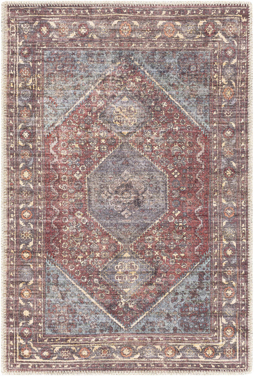 Detailed view of the Maplesville Washable Area Rug in beige, pink, plum, green, rust, and teal with a traditional diamond pattern. Design-Rectangle-23