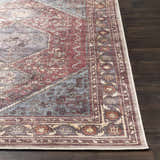 Close-up of the traditional Maplesville Washable Area Rug. Colors include beige, dark pink, plum, green, rust, and teal. Front