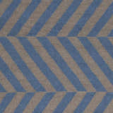 Close-up of the Mauckport Area Rug, a hand woven wool rug with charcoal and dark blue diagonal stripes. Swatch