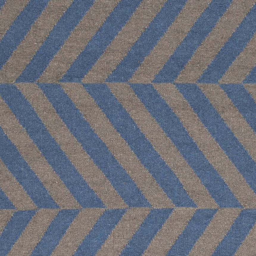 Close-up of the Mauckport Area Rug, a hand woven wool rug with charcoal and dark blue diagonal stripes. Swatch