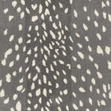 Close-up of the Athena Gray Giraffe Print Wool Rug. Cream spots on a gray, hand-tufted wool rug. Contemporary animal print. Swatch