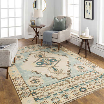 Living room scene with McColl Hand Knotted Wool Blend Rug in brown, cream, teal. Contemporary rug anchors the neutral space. Roomscene-Rectangle