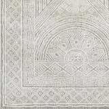 Close up of the Middleville Luxe Rug, a contemporary rug in charcoal, cream, and gray with geometric patterns. Swatch