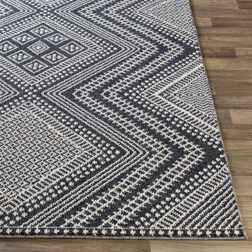 Close-up of the Madison Black&White Area Rug showing its geometric, bohemian pattern and jute/polypropylene texture. Front
