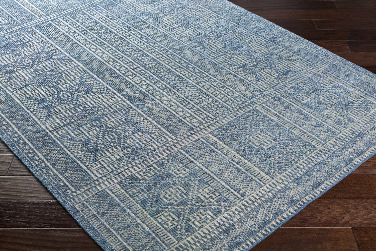 Close-up of the Meigs Blue Premium Viscose & Wool Rug showing its geometric, bohemian-inspired pattern and texture. Corner