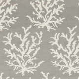 Close-up of the Merchantville Area Rug. Ivory coral-like pattern on a light gray, hand-woven, 100% wool rug. Swatch