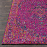 Close up of the Milliken Magenta Area Rug showing its burgundy, orange, gray, and navy traditional pattern. Front