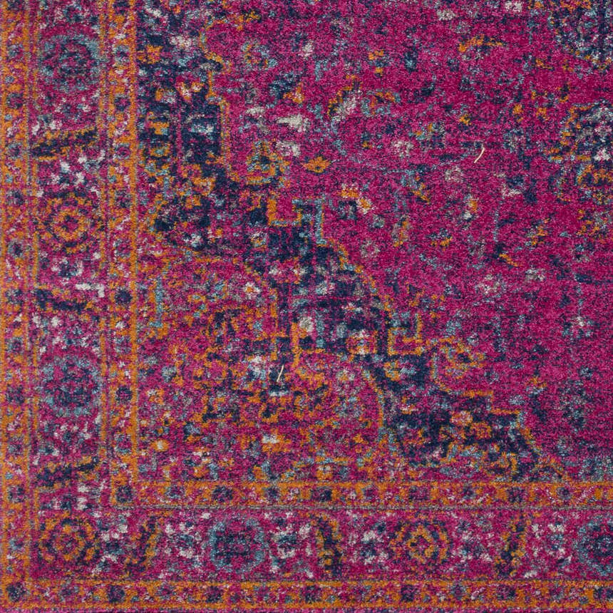 Close-up of the Milliken Magenta Area Rug, showcasing its burgundy, orange, navy, and teal traditional pattern. Swatch