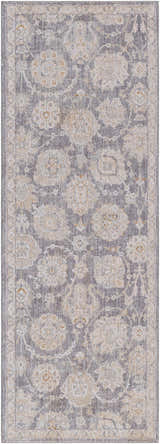 Close-up of the Mimarsinan Thick Luxe Statement Rug. Features a traditional floral pattern in gray, beige, and brown tones. Design-Runner-2773