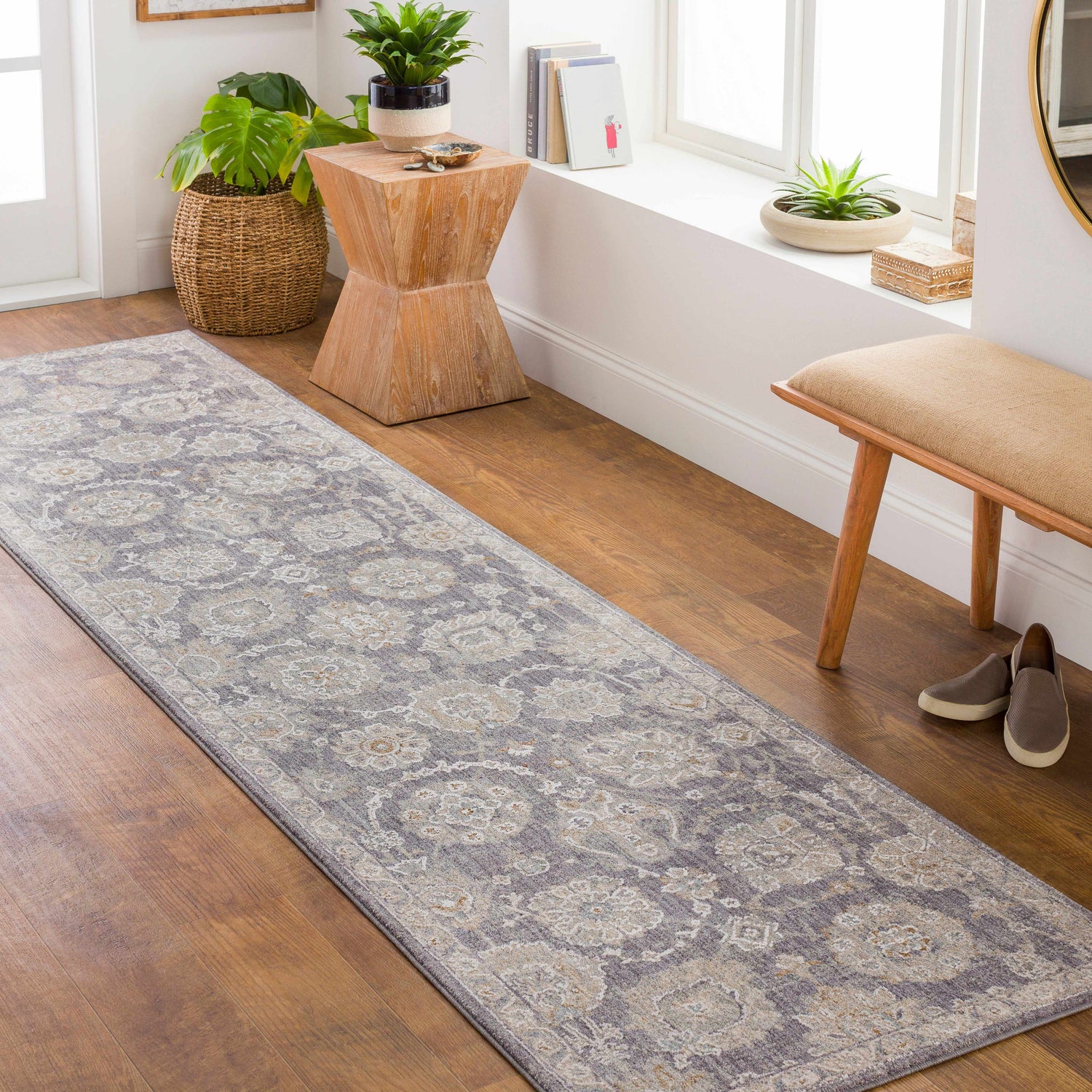 Entryway with a Mimarsinan Thick Luxe Statement Rug runner in gray and beige, paired with a wooden bench and plants. Roomscene-Runner