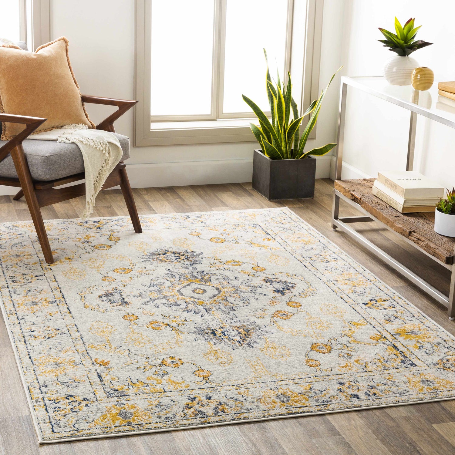 Living room scene with the Mistley Area Rug in light beige, burnt orange, and navy. Mid-century modern style. Roomscene-Rectangle