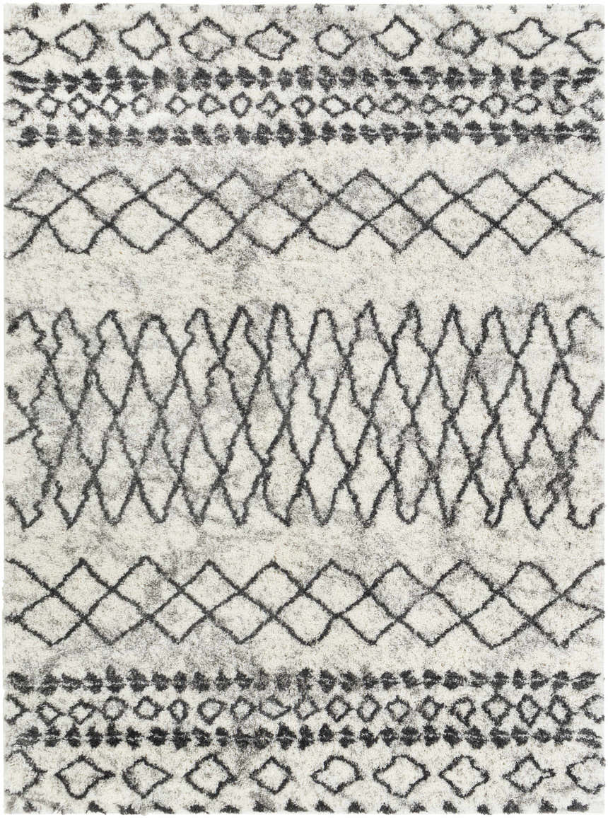 Close-up of Moulden Area Rug: a shag rug with charcoal geometric patterns on a cream base. Transitional style. Design-Rectangle-5373