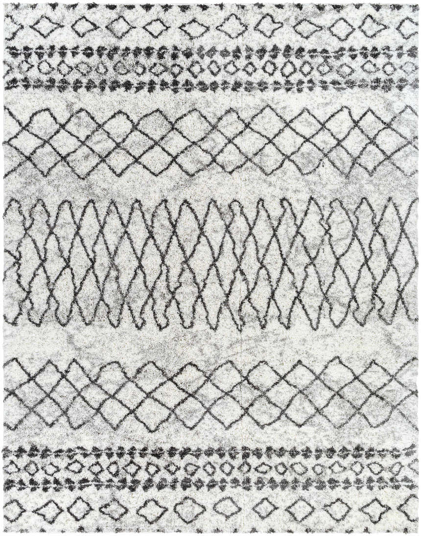 Close-up of the Moulden Area Rug. Shag rug with charcoal diamond and geometric patterns on a cream background. Design-Rectangle-71010