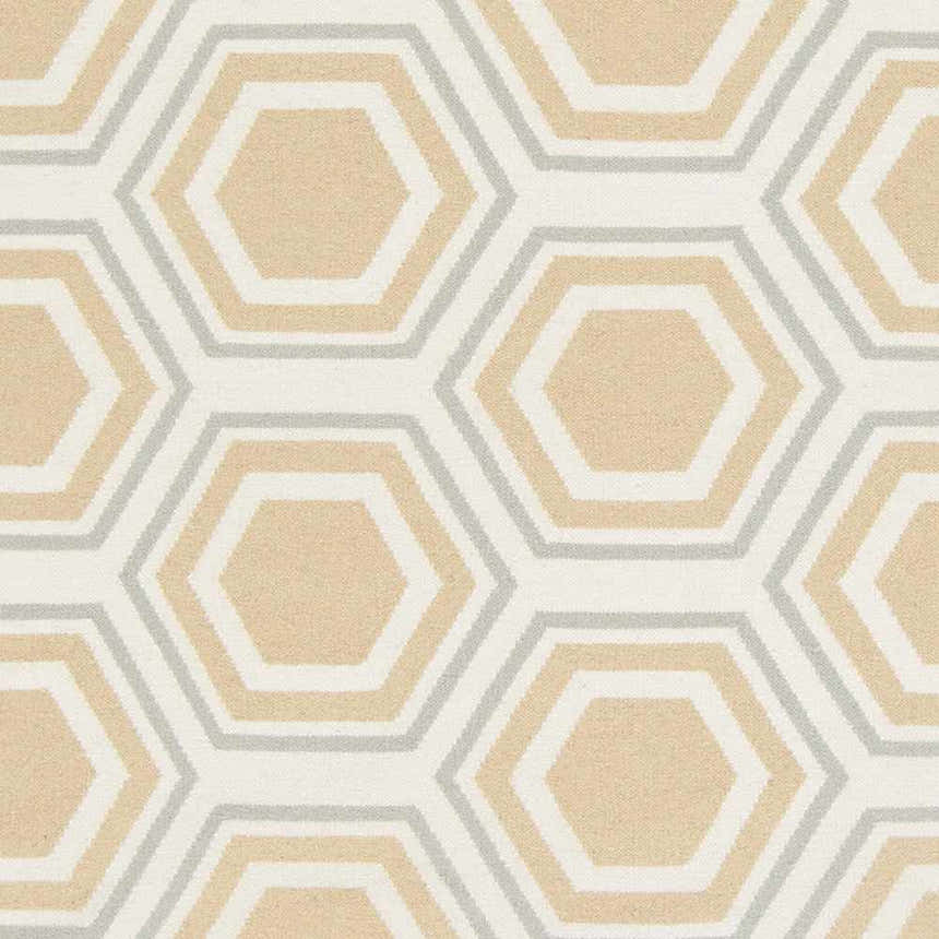 Close-up of Millstone Area Rug. Beige hexagons with sage and tan accents on a hand-woven wool rug. Swatch