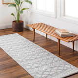 Entryway with wood floors, bench, and gray geometric Meng Area Rug runner. Roomscene-Runner