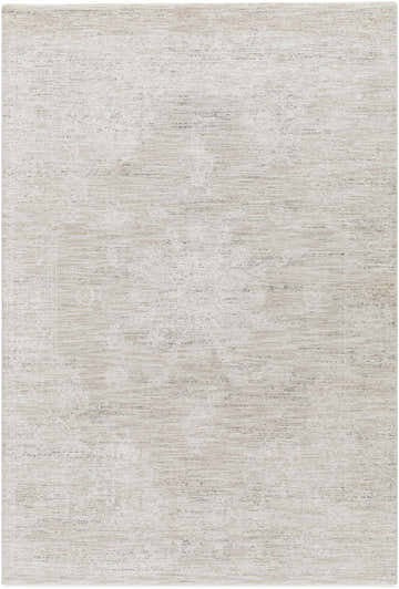 Close-up of the Monto Luxe Rug, a machine-woven rug in cream, taupe, and gray with a subtle, traditional pattern. Design-Rectangle-575