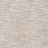 Close-up of the Monto Luxe Rug. Machine-woven polyester rug in charcoal, cream, gray, and taupe with a subtle, textured pattern. Swatch