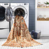 Laundry room scene with Mantalongon Washable Area Rug coming out of the washing machine. Easy-to-clean rug. Washing-Machine