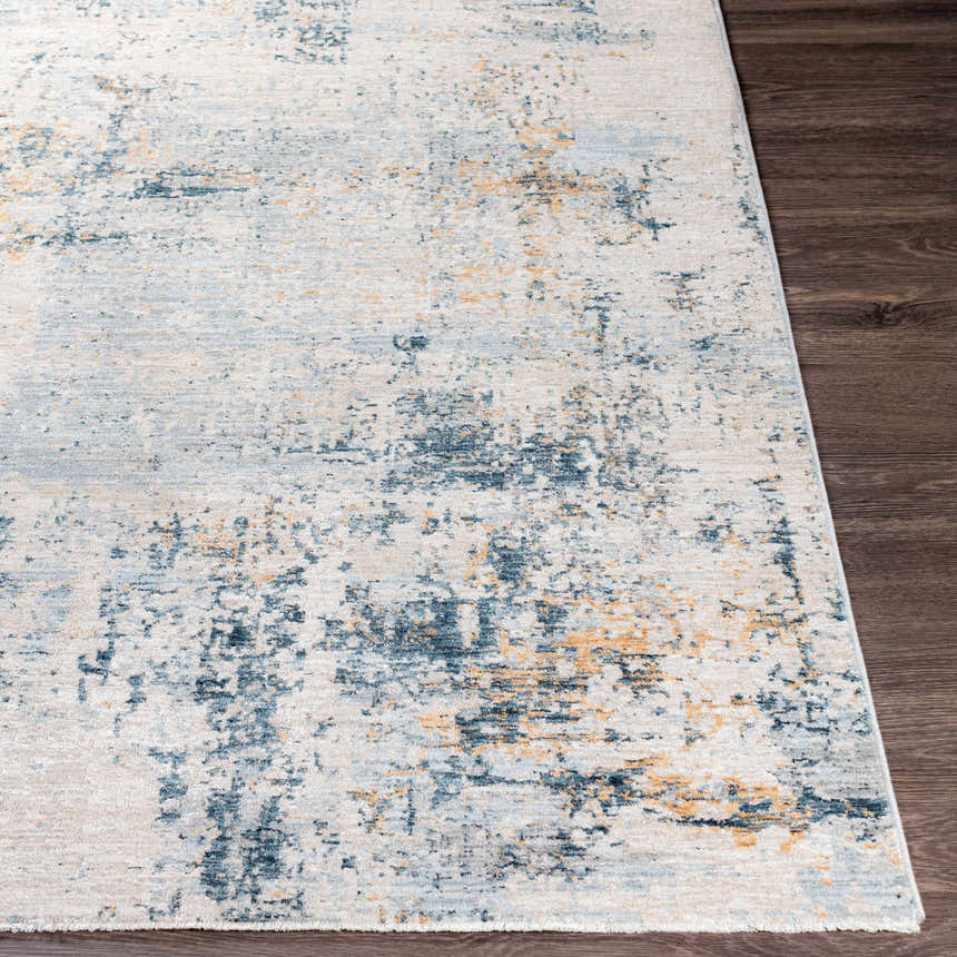 Close-up of the Montreat Luxe Rug showing its cream, gray, teal, and mustard abstract pattern and soft texture. Front