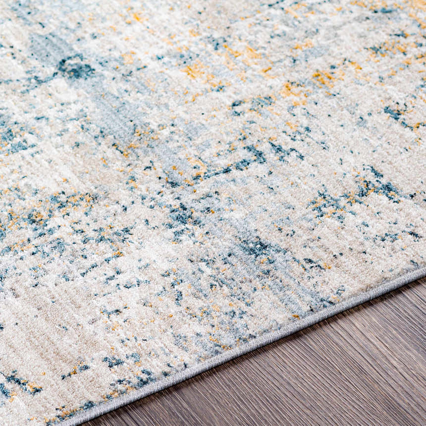 Close-up of the Montreat Luxe Rug showing its cream, teal, and mustard abstract design and soft texture. Texture