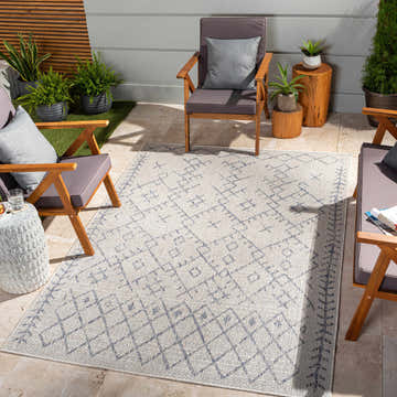 Outdoor patio scene with the Maunawili Blue Detailed Gray Rug, wood chairs, and potted plants. Relaxing, modern style. Roomscene-Rectangle