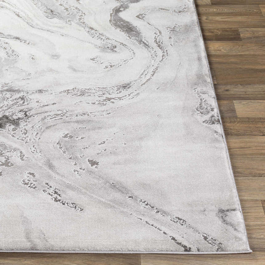 Close-up of the Moana Charcoal Marble Rug, showing its gray and white swirling marble pattern and soft texture. Front