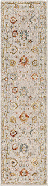 Close-up of a Mogul Luxe Oushak Rug. The rug features a traditional floral pattern in brick red, cream, denim, and tan tones. Design-Runner-2710