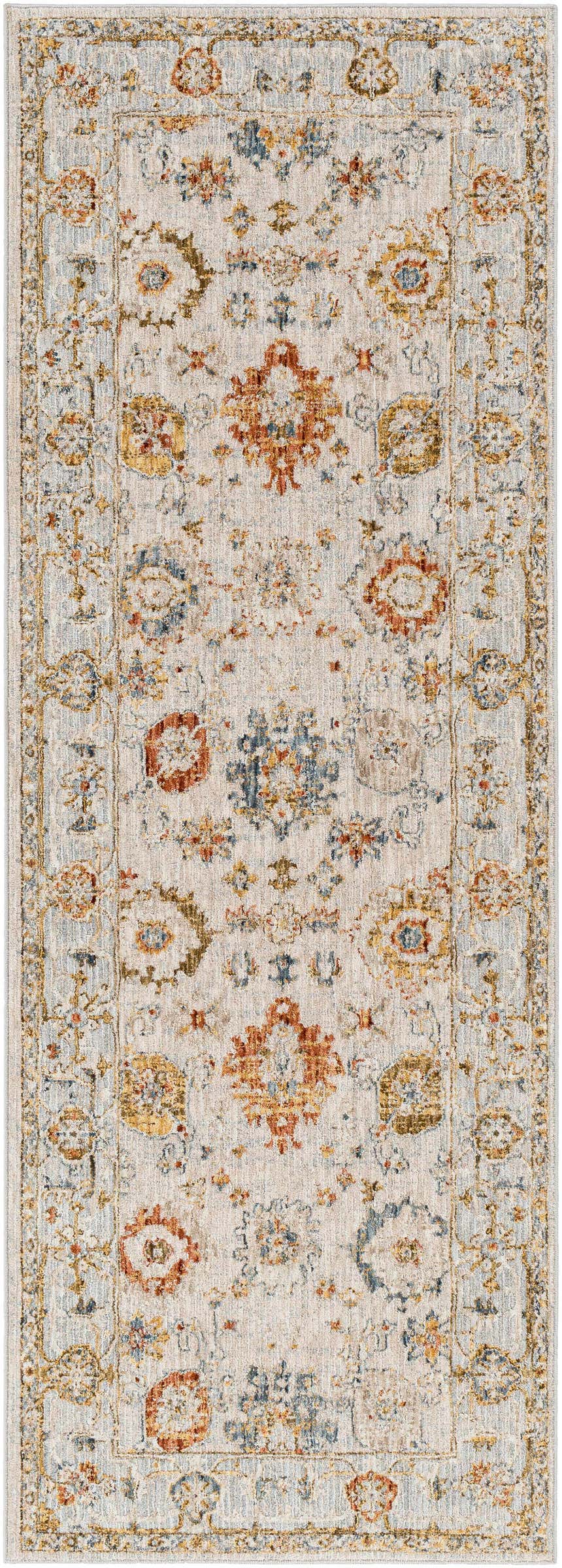 Close-up of the Mogul Luxe Oushak Rug. Features a traditional floral pattern in brick red, cream, denim, and mustard tones. Design-Runner-2773