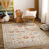 Living room scene with a brick red, cream, and denim Mogul Luxe Oushak Rug, wood chair, and decorative vases. Roomscene-Rectangle