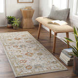 Entryway scene with a Mogul Luxe Oushak Rug runner in brick red, cream, and denim, bench, wood table, and plants. Roomscene-Runner