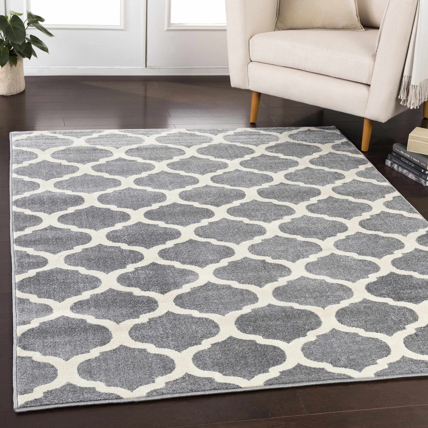 Living room scene with a cream armchair and gray and cream Mongo Carpet. Roomscene-Rectangle