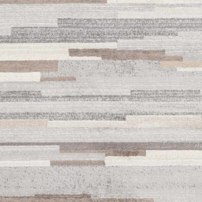 Close-up of the Monkland Area Rug showcasing its contemporary charcoal, gray, tan, and white horizontal block pattern. Swatch