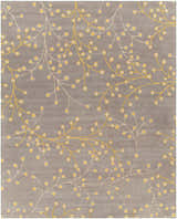Close-up of Elsu Mustard Wool Area Rug featuring a floral pattern in mustard and taupe on a charcoal background. Design-Rectangle-7696