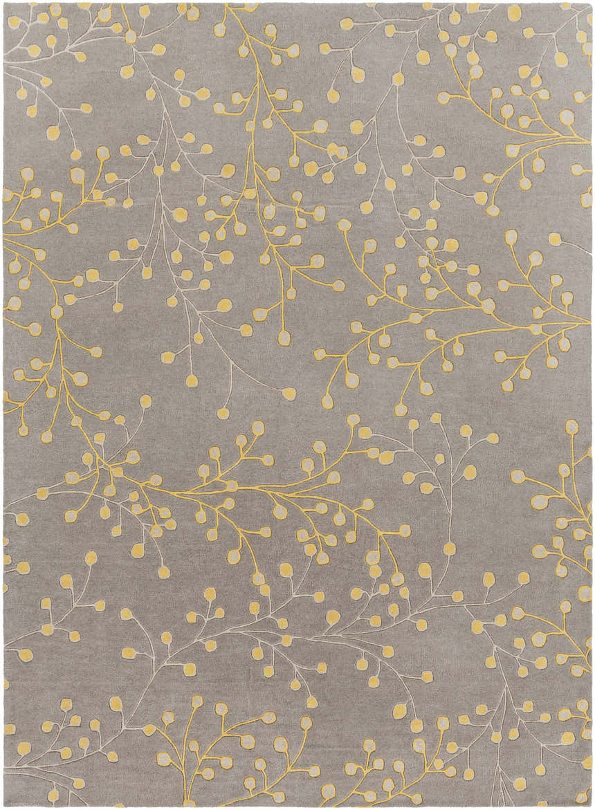 Close-up of Elsu Mustard Wool Area Rug featuring a gray background with a floral pattern in mustard and taupe. Design-Rectangle-811