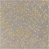 Close-up of the Elsu Mustard Wool Area Rug showing the floral branch pattern in mustard and taupe on a charcoal background. Design-Square-8