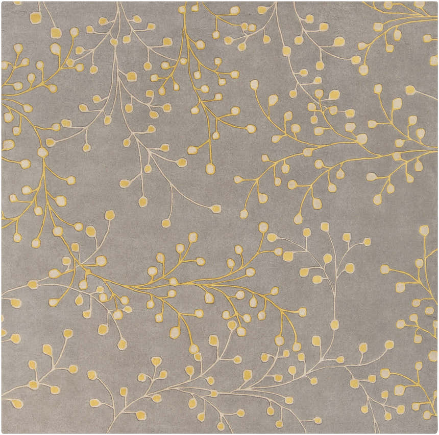 Close-up of the Elsu Mustard Wool Area Rug showing the floral branch pattern in mustard and taupe on a charcoal background. Design-Square-8