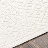 Close up of the cream Maribyrnong 3D Outdoor Area Rug showing its textured, geometric, bohemian pattern. Texture