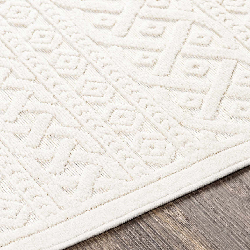 Close up of the cream Maribyrnong 3D Outdoor Area Rug showing its textured, geometric, bohemian pattern. Texture