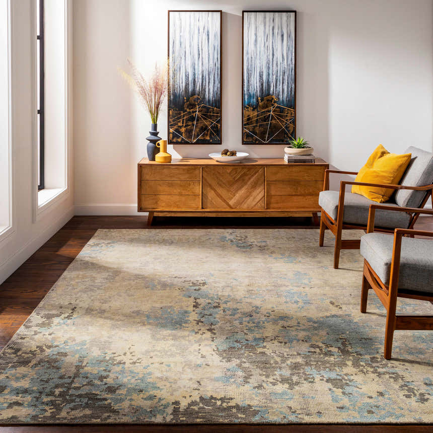 Living room scene with a Marco Handmade Wool Rug, wood console table, and mid-century modern chairs. Rug colors: cream, denim, and charcoal. Roomscene-Rectangle